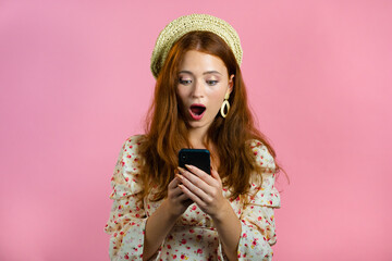 Attractive woman receives happy notification on mobile phone. woman is beside herself with surprise and joy. She won and rejoices. Technology, success, victory, happiness concept.