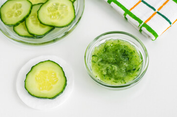Small glass bowl with cucumber puree. Homemade face or eye mask, natural beauty treatment and spa recipe.