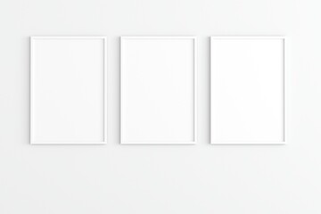 Empty photo frame hanging for mockup in empty white room. 3D rendering.