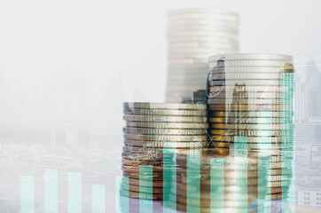 double exposure of city with row of coin stack with growth chart and graph progress report for business investment finance banking and money saving concept.