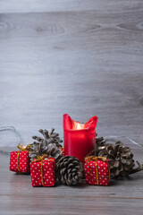 red christmas gifts with pine cones