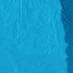Blue torn paper collage close-up. Texture made from various paper and cardboard parts. Damaged old paper background. Vintage blank wallpaper. Material design backdrop.