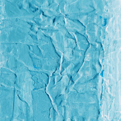 Blue torn paper collage close-up. Texture made from various paper and cardboard parts. Damaged old paper background. Vintage blank wallpaper. Material design backdrop.