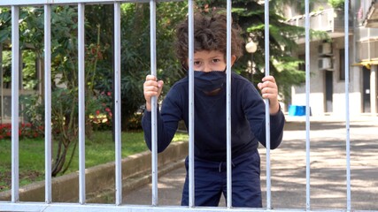 Europe, Italy , Milan - life style of boy six years old with mask during Covid-19 quarantine home lockdown outbreak 
