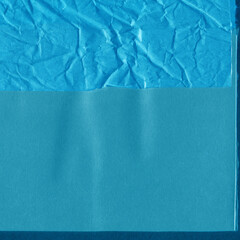 Blue torn paper collage close-up. Texture made from various paper and cardboard parts. Damaged old paper background. Vintage blank wallpaper. Material design backdrop.