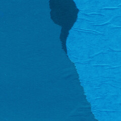 Blue torn paper collage close-up. Texture made from various paper and cardboard parts. Damaged old paper background. Vintage blank wallpaper. Material design backdrop.