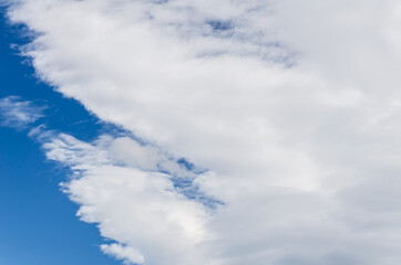 White clouds in a bright blue sky. The beauty of the nature