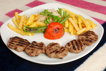 Grilled meat balls. Grilled meatball with potatoes chips.