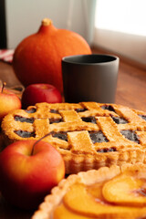 Close up of homemade traditional sweet autumn raspberry tart pie on wooden table