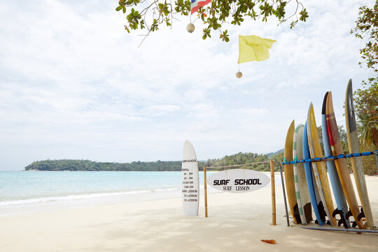 Panoramic view of surfboards on nice summer tropical beach