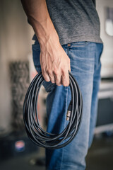 Behind the scene. Sound engineer is connecting the audio cables in the theater