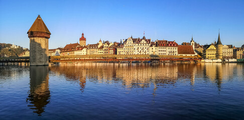 Ultra wide panorama of Luzern with house reflected in the Reuss River