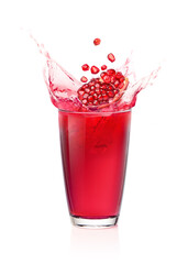 Glass of Pomegranate juice splashing  with Pomegranate fruit  isolated on white background.