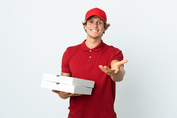 pizza delivery man over isolated white background shaking hands for closing a good deal