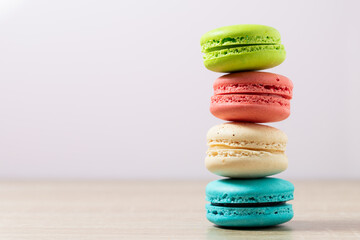 Fototapeta na wymiar Cake macaron or macaroons on pastel background with copy space, Sweet and colorful dessert