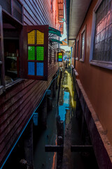 Fototapeta premium Narrow waterways separate house on the settlement built on stilts of Ko Panyi in Phang Nga Bay, Thailand