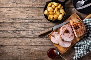 Stuffed chicken with nuts on rustic wooden table.Top view. Copy space	