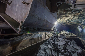 Ore minecart wagon witn ore schute in underground mine