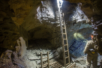 Underground gold ore mine tunnel with ladder stairs