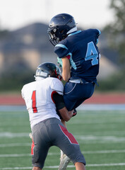 Amazing athletes making great catches and runs during a competitive football game