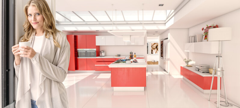 Woman Having A Coffee In A Modern Red Kitchen