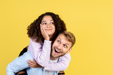 Two mixed race people on yellow background