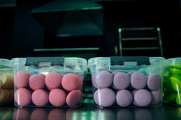 lots of macarons in transparent boxes
