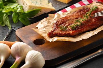 Grilled beef steak served on plate close up