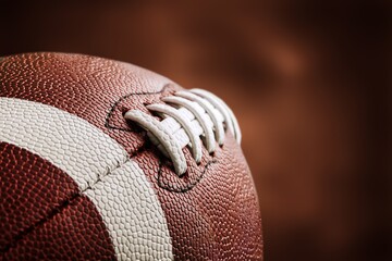 American leather football ball on background