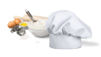 Classic white chef hat on the desk