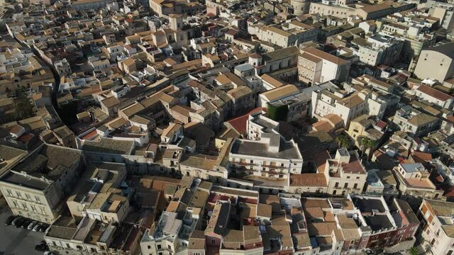 Sicilian coastal village from the top. Aerial view over the house's roofs with ancient tiles in the mediterranean town Ortigia (Ortygia) island in Siracusa (Syracuse) in Sicily
