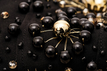 Close up flower of black beads and golden threads