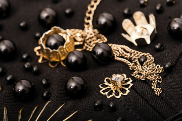 Embroidery composition of flowers and black beads on fabric