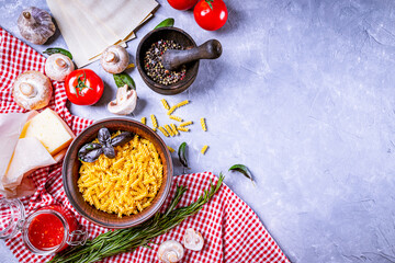  Ingredients for making italian pasta on a gray background, copy space top view