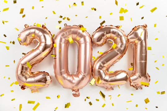 Foil balloons numeral 2021 and confetti 