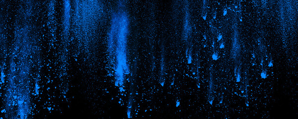 Blue powder explosion. Striped abstract blue dust isolated on black background. Paint burst