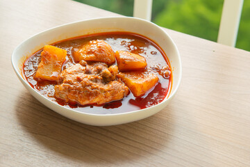 Thai Chicken massaman curry - Thai chicken and potato curry in coconut milk and herb eat with white rice