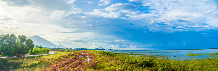 Fototapeta na wymiar View of beautiful sunset with blue sky in Dau Tieng lake, Tay Ninh province, Vietnam.