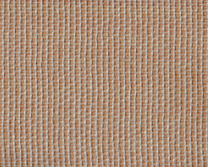Glasfasertapete über leuchtend orangefarbenem Papier. Die Kombination hat eine Art goldenes...