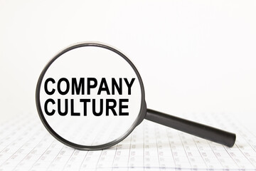 text COMPANY CULTURE in a magnifying glass, office concept, business concept, Finance