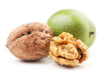 Young walnut, whole, in peel and kernel on a white background. Isolated