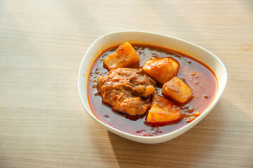 Thai Chicken massaman curry - Thai chicken and potato curry in coconut milk and herb eat with white rice