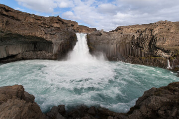 Iceland waterfall on the rocks
