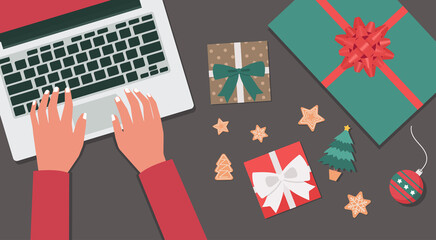 human hand using a laptop with presents, cookies, and Christmas tree, vector flat lay illustration