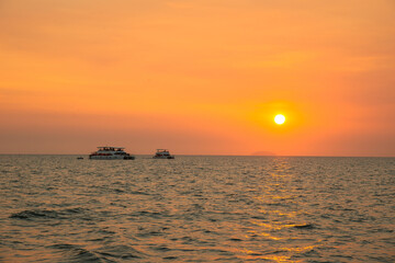 2 yacht floating over ocean in golden sunset time