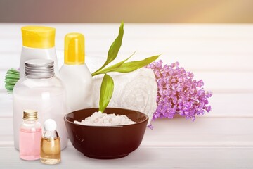 Obraz na płótnie Canvas Pile of lavender flowers and a dropper bottle with lavender essence