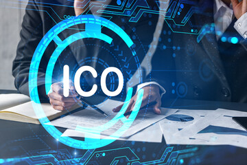 Two businesswomen working together in office. ICO holographic illustration double exposure.