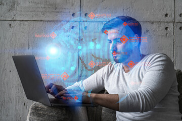 A serious caucasian manager in casual wears, using laptop to develop a new worldwide supply chain. Double exposure. globe and map hologram.