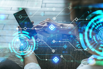 A man in casual wears, using smart phone. Double exposure. Tech theme hologram.