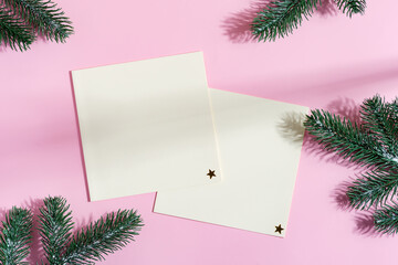 Festive Christmas mock-up card with garland and fir twigs.